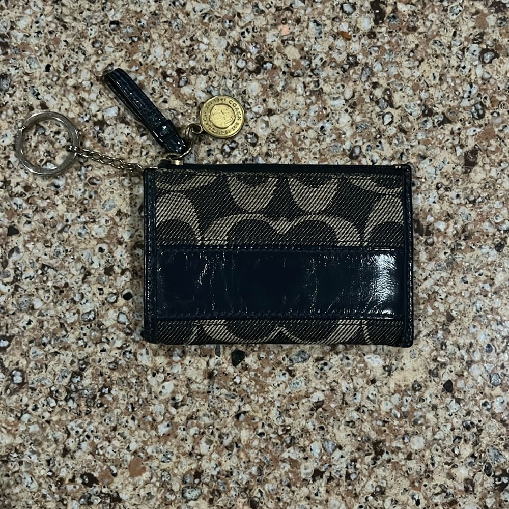 Coach key chain with card/money holder. Color is navy with cream logo